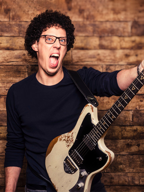 Andy Ferris The Guitar Geek Profile Photo Holding Guitar with a Rockstar Face